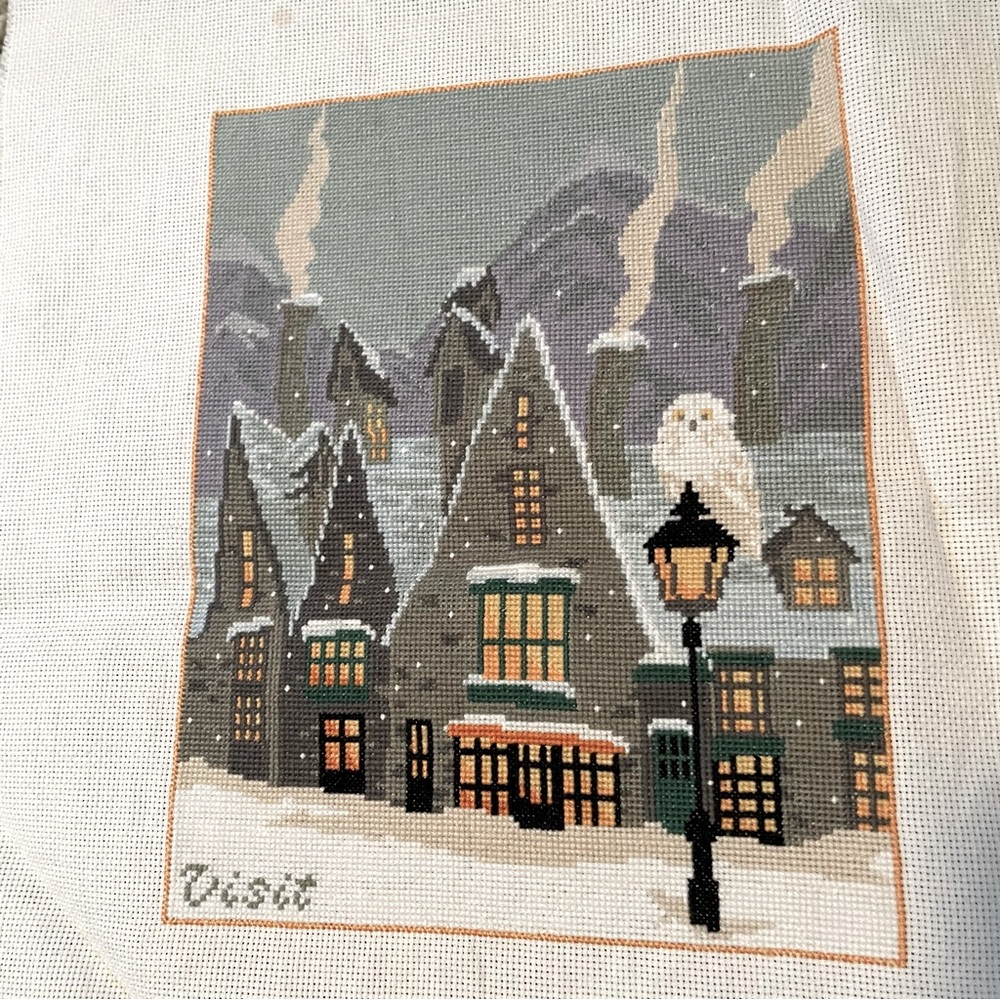 Cross stitch artwork, around 8x10. Harry Potter/Hogsmeade scene.